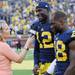 Michigan quarterback Devin Gardner chats with a Big Ten Network reporter as running back Fitzgerald Toussaint looks on after the Wolverines beat Central Michigan 59-9 at Michigan Stadium on Saturday, August 31, 2013. Melanie Maxwell | AnnArbor.com